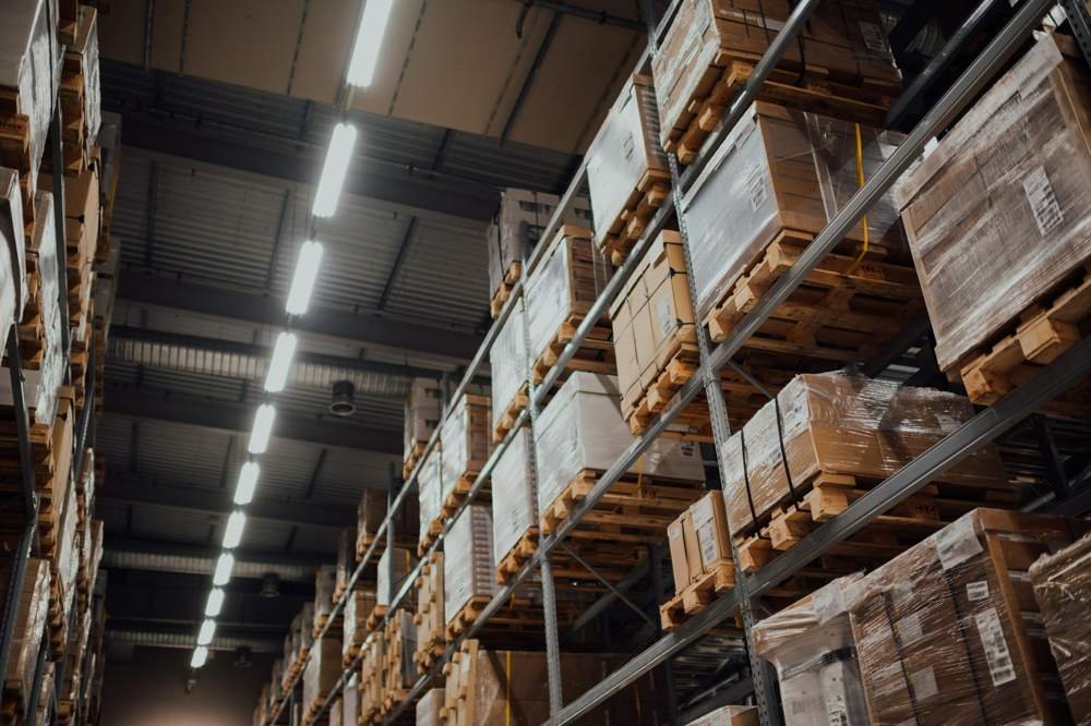 Warehouse racks stocked with boxed industrial material